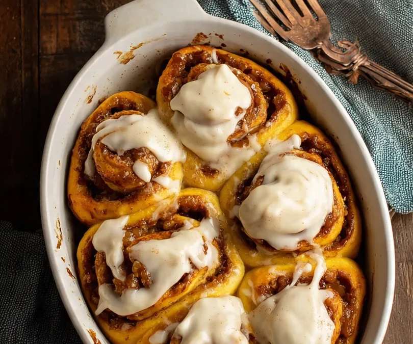 Spiced Peach Cobbler Cinnamon Rolls with Creamy Frosting